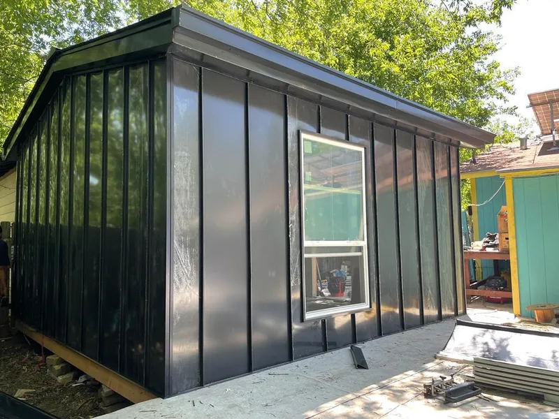 Black standing seam metal wall panels for Roof Inspection in La Homa